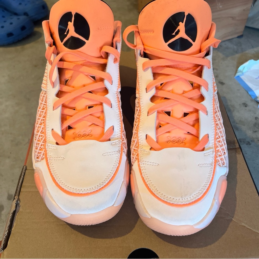 Jordan 38 low crimson tint/orange pulse.